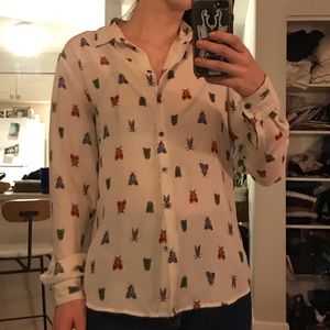 Moth pattern button up shirt.